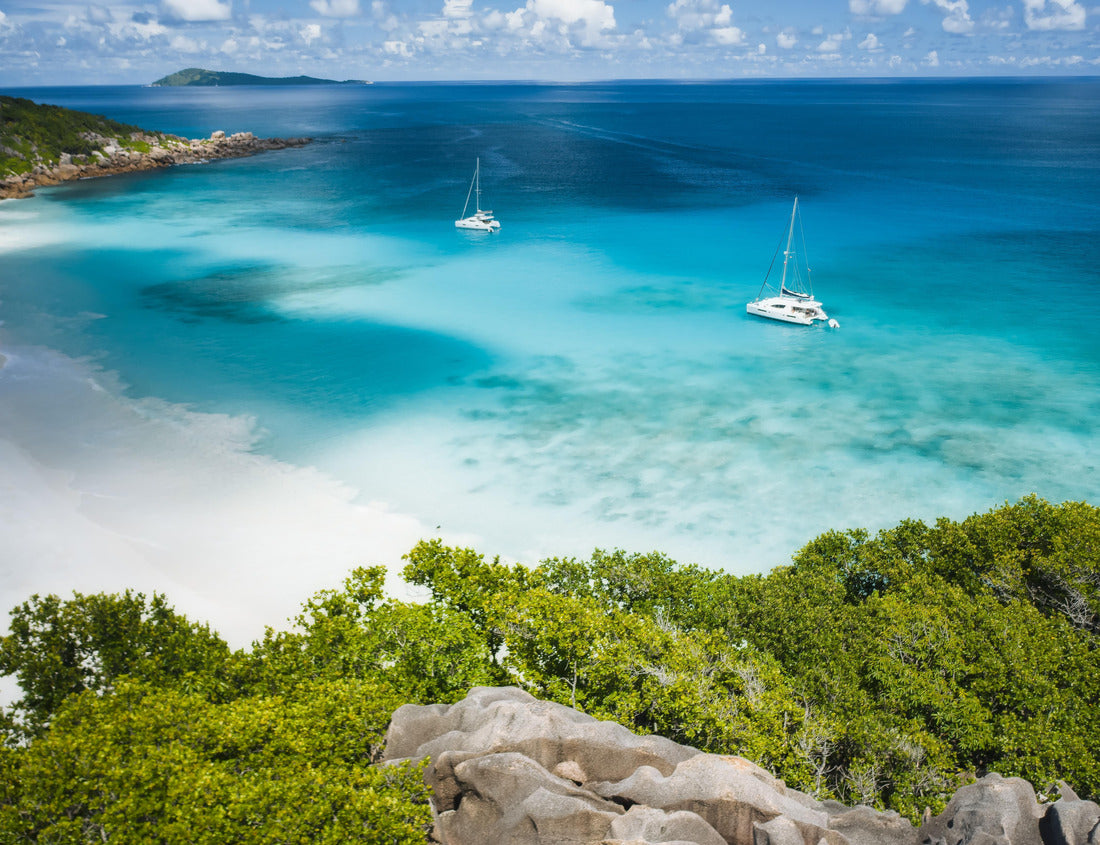 Noah Jigsaw Puzzle Aerial of Grand Anse beach at La Digue island in Seychelles. White sandy beach with blue ocean lagoon and catamaran yacht moored 1000 pieces