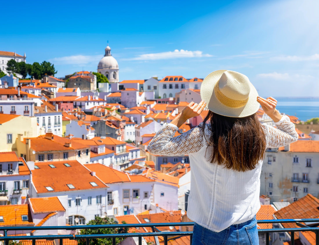 Noah Jigsaw Puzzle A tourist woman looks at the beautiful cityscape of Lisbon, with the colorful houses and roofs at the Alfama district, Portugal 1000 pieces