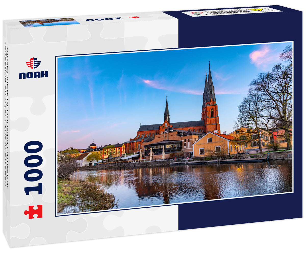 Sunset view of Uppsala cathedral reflecting on river Fyris in Sweden