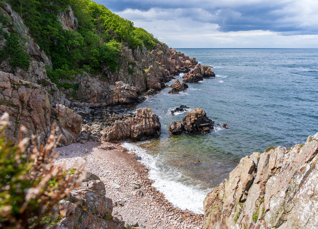 Rocky beach and beautiful natural surroundings summer time at Kullaberg nature reserve in south Sweden
