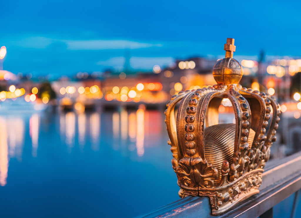 Stockholm, Sweden. Skeppsholmsbron - Skeppsholm Bridge With Its Famous Golden Crown In Night Lights. Famous Popular Place Landmark Destination. Scandinavia Travel