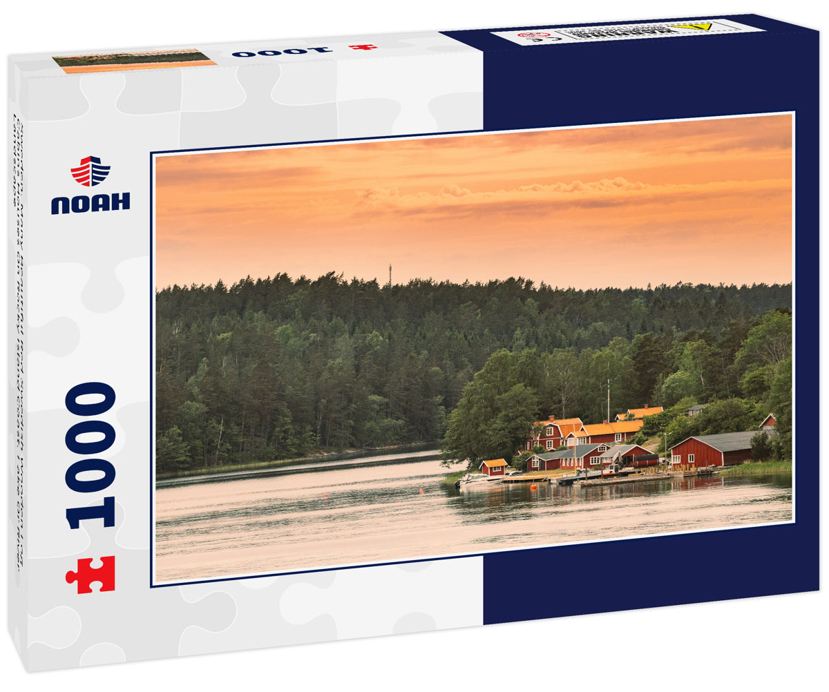 Sweden. Many Beautiful Red Swedish Wooden Log Cabins Houses On Rocky Island Coast. Lake Or River Landscape