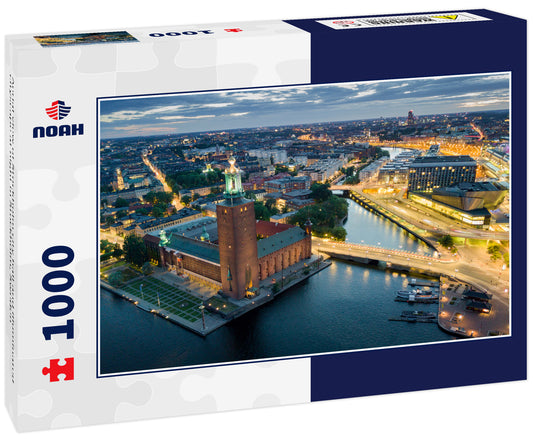 Aerial view of Stockholm city hall and illuminated cityscape at night in Stockholm, Sweden