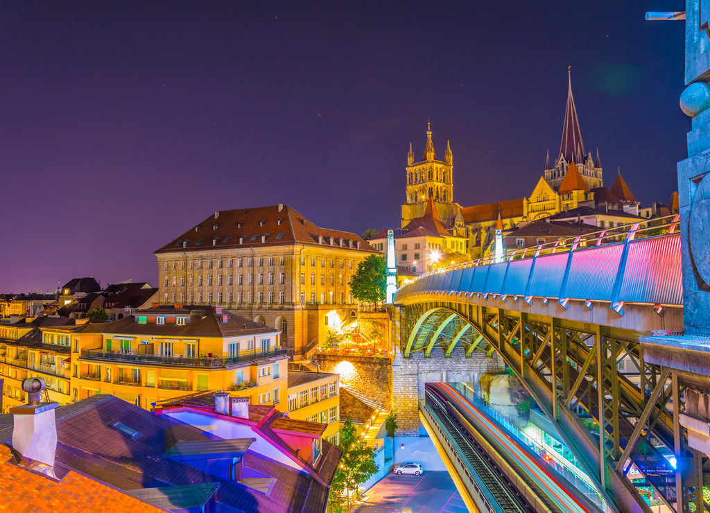 Night view of the Lausanne gothic cathedral Behind Charles Bessieres bridge, Switzerland