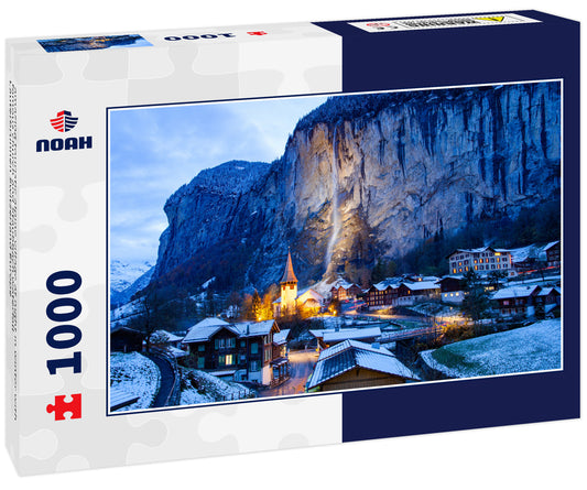 amazing touristic alpine village at night in winter with famous church and Staubbach waterfall Lauterbrunnen Switzerland Europe