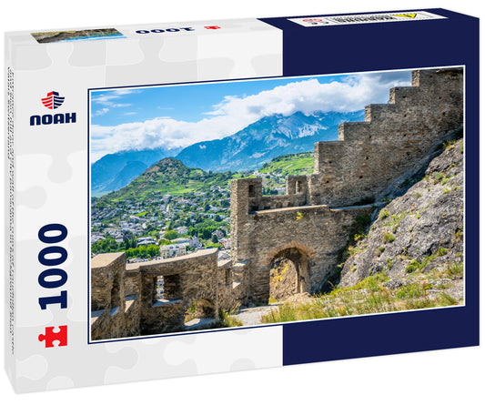 Entrance door and wall of the ruins of Tourbillon castle and Sion hill and city panorama in background Sion Valais Switzerland