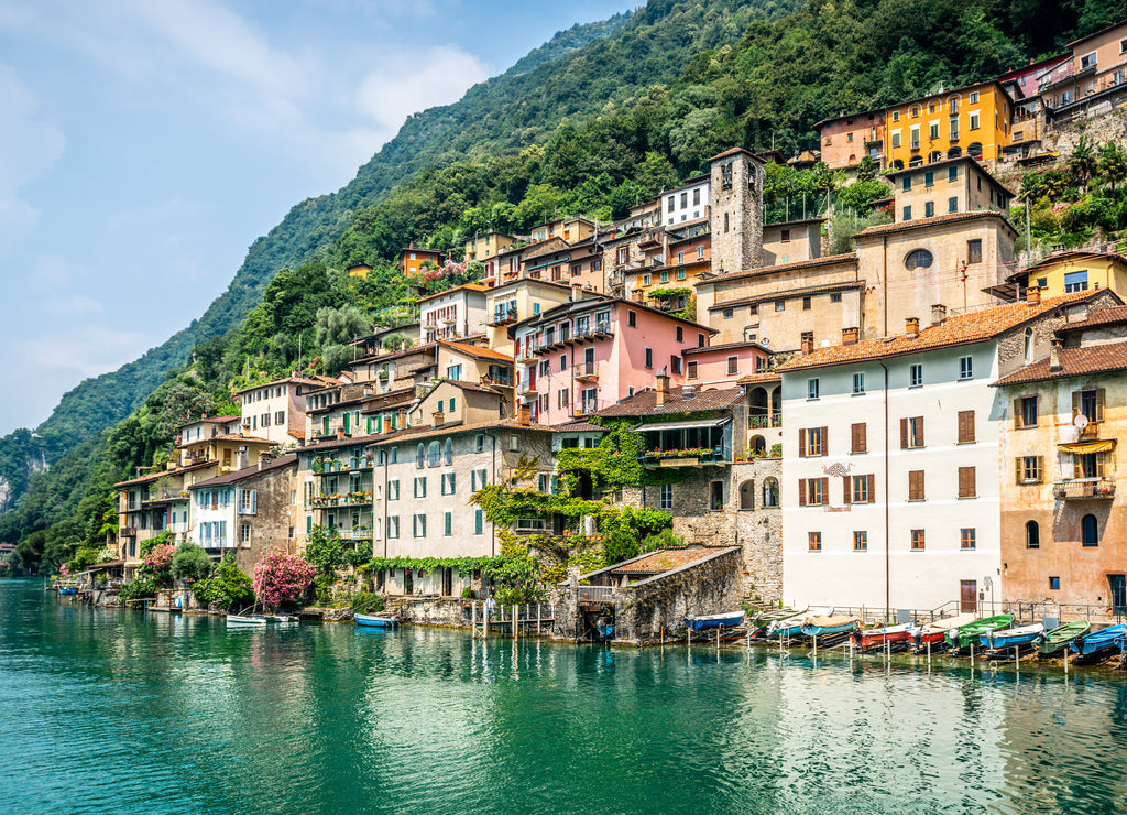 View of Gandria fishermen village with colorful houses on Lake Lugano lakeside on beautiful summer day in Switzerland