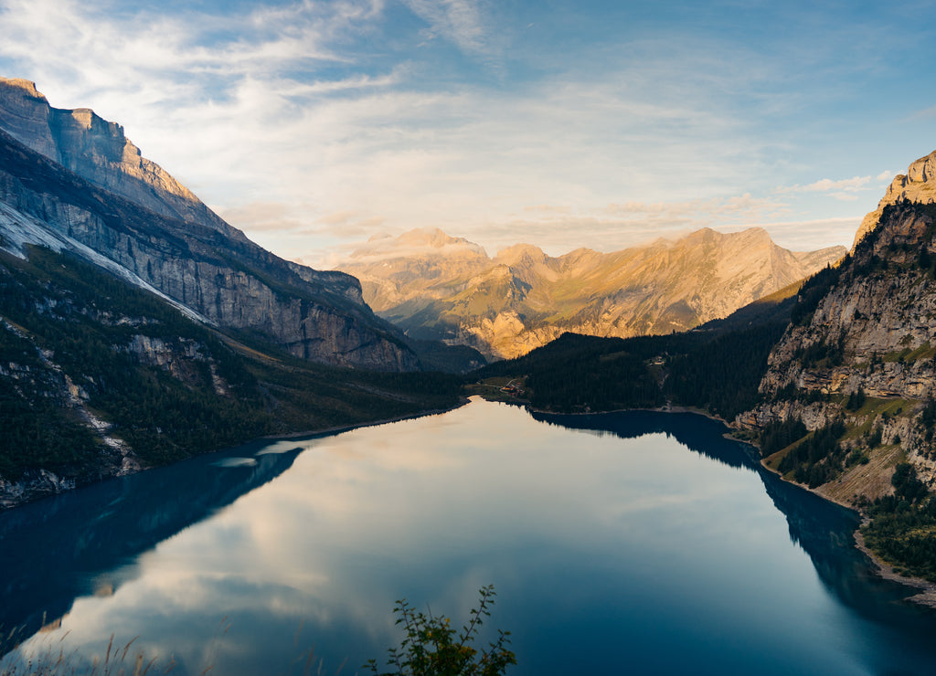 Idyllic panorama view of the lake Oeschinensee. Picture or postcard view of Oeschinen Lake by Kandersteg, Switzerland