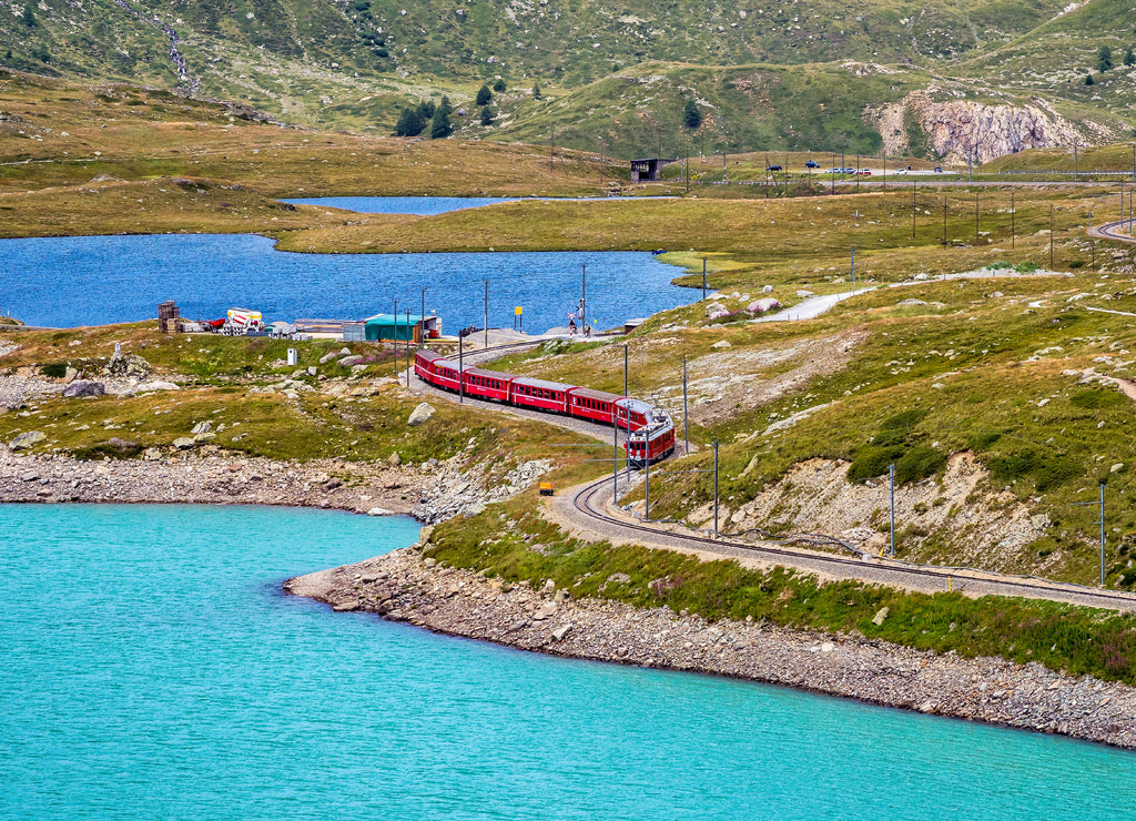 Bernina Express at the White Lake in Ospizio Bernina, Engadin, Switzerland