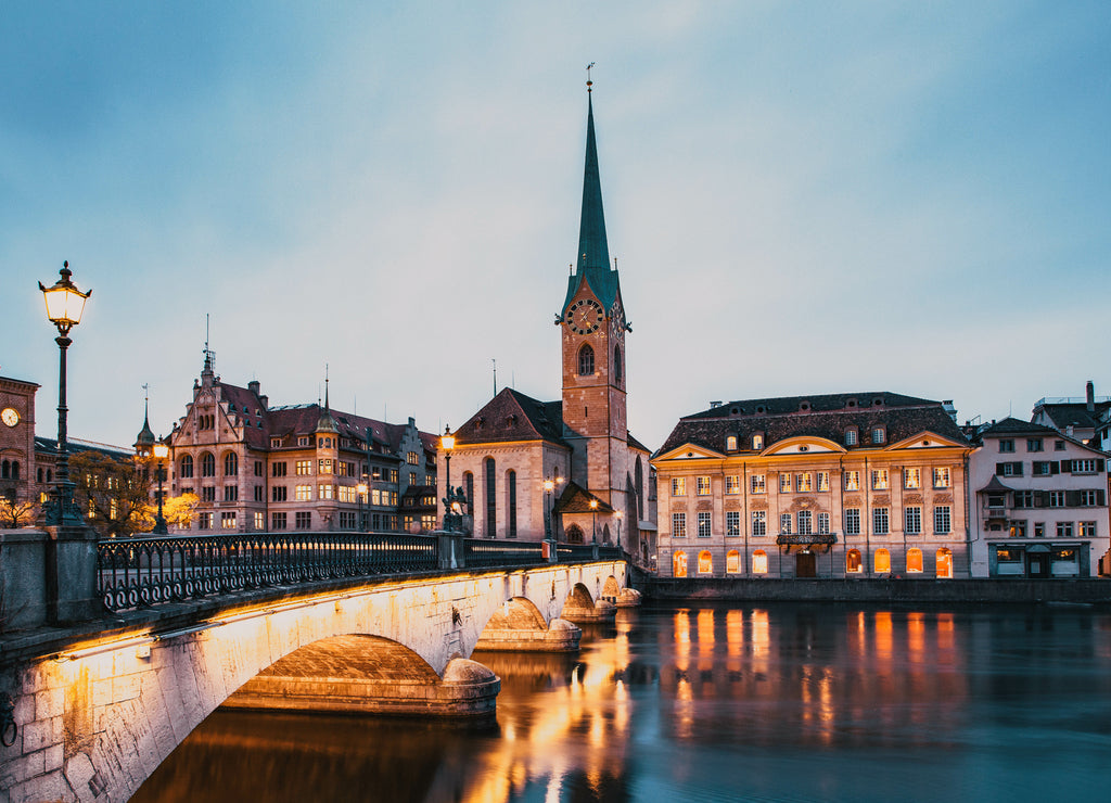 Scenic view of historic Zurich city center with famous Fraumunster and Grossmunster Churches and river Limmat at Lake Zurich, Canton of Zurich, Switzerland