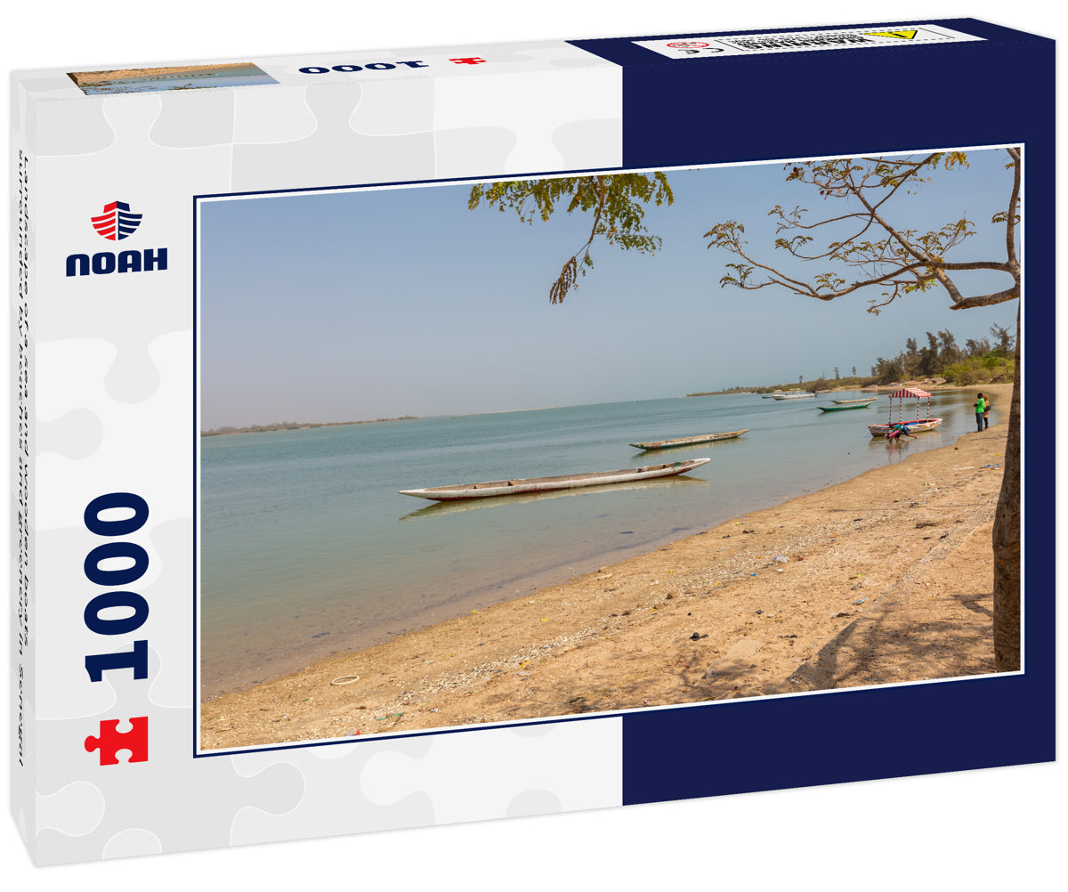 Landscape of a sea and wooden boats surrounded by beaches and greenery in Senegal