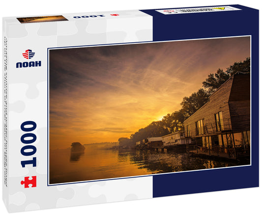 Amazing sunrise and water houses lined up on the shore of river Sava in Belgrade
