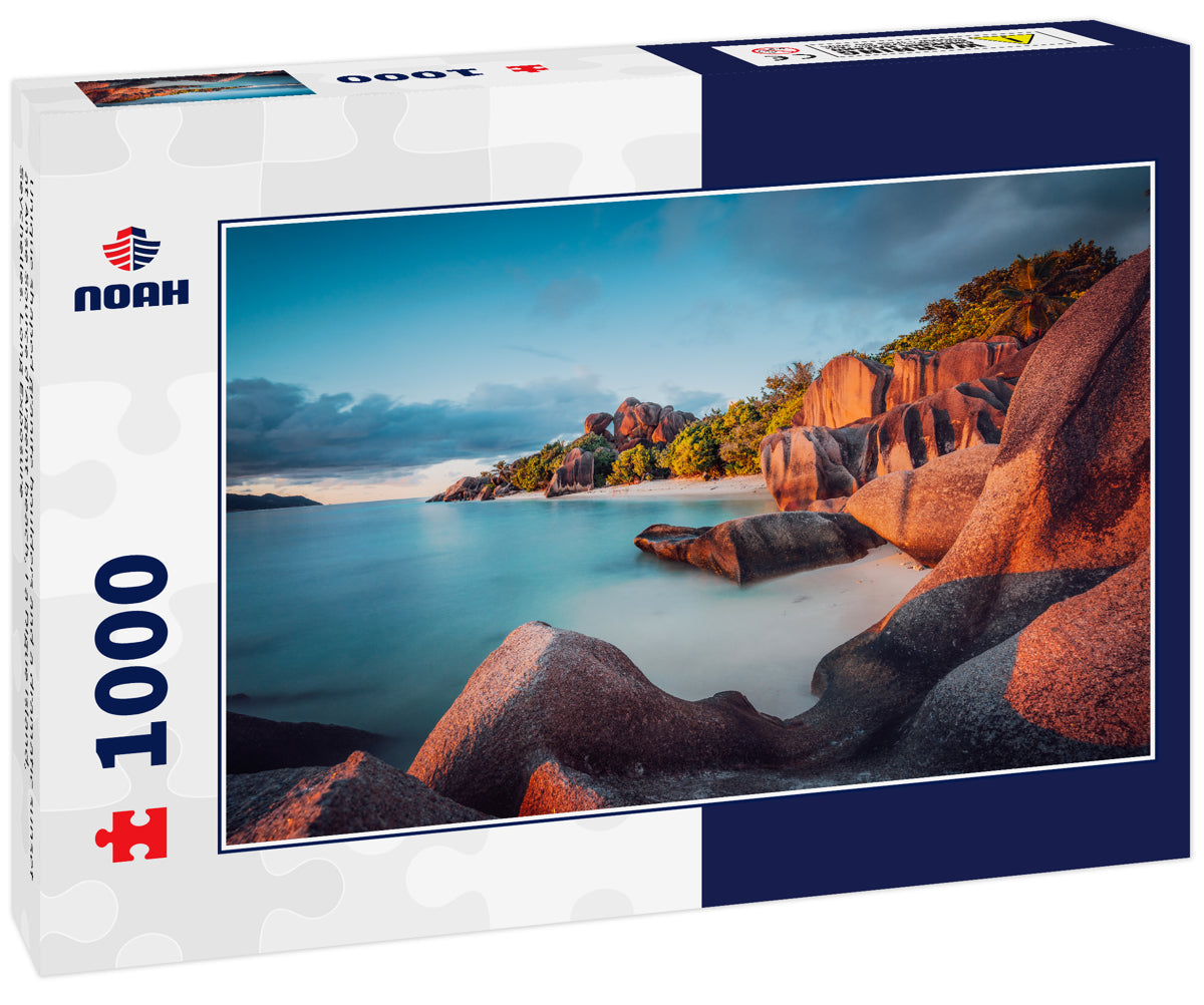 Unique shaped granite boulders and a dramatic sunset at Anse Source d'Argent beach, La Digue island, Seychelles. Long Exposure