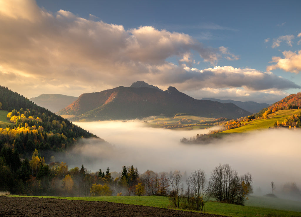 Landscape with mountains at foggy sunrise in autumn. Mala Fatra National Park, near the village of Zazriva in Slovakia, Europe