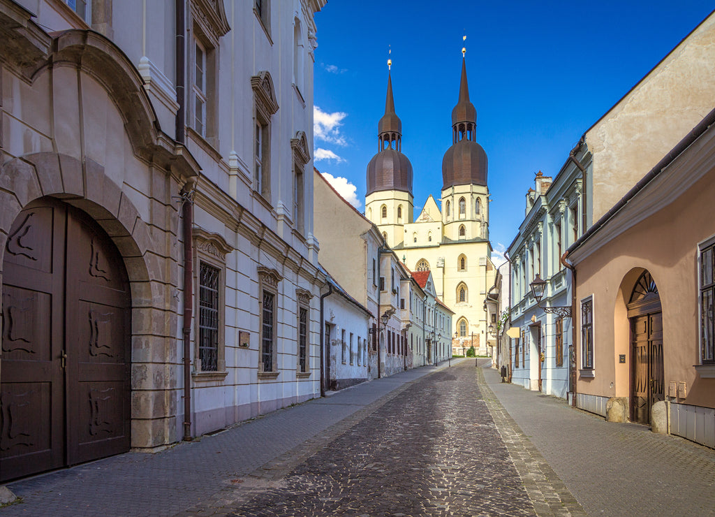 Historic street leading to The Saint Nicholas Church, a Gothic cathedral in Trnava town, Slovakia, Europe