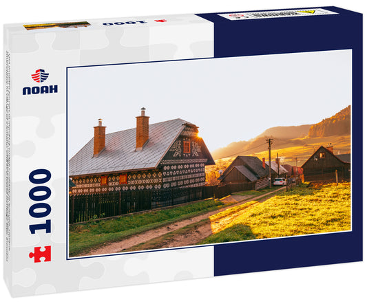 Old wooden houses in Slovakia village Cicmany in autumn. Unique decoration of log houses based on patterns used in traditional embroidery in village of Cicmany, UNESCO World Heritage Site, Slovakia