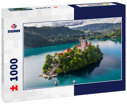 Bled, Slovenia - Beautiful morning at Lake Bled (Blejsko Jezero) with the Pilgrimage Church of the Assumption of Maria and traditional Pletna boats