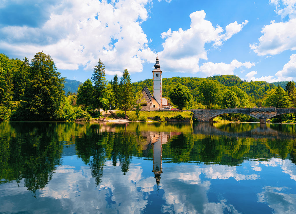 Scenery and Church of St John Baptist on Bohinj Lake at Slovenia. Nature in Slovenija