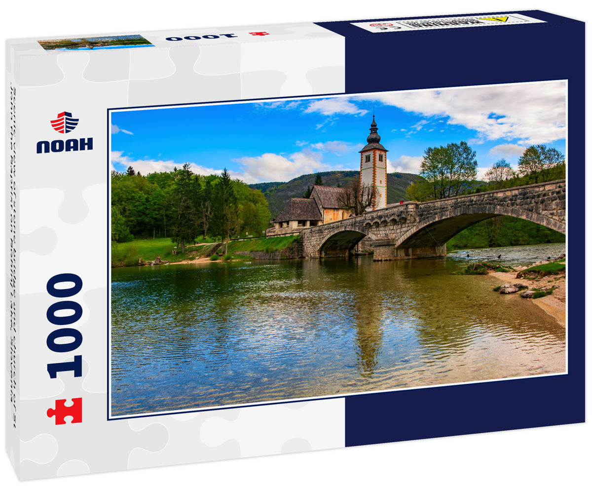 Scenic view of stone bridge and church of St John the Baptist on Bohinj Lake, Slovenia