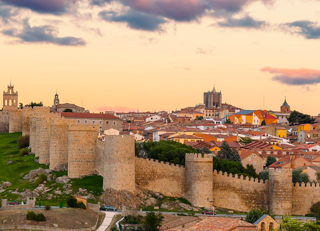 Walls of Medieval city of Avila at sunset, Spain