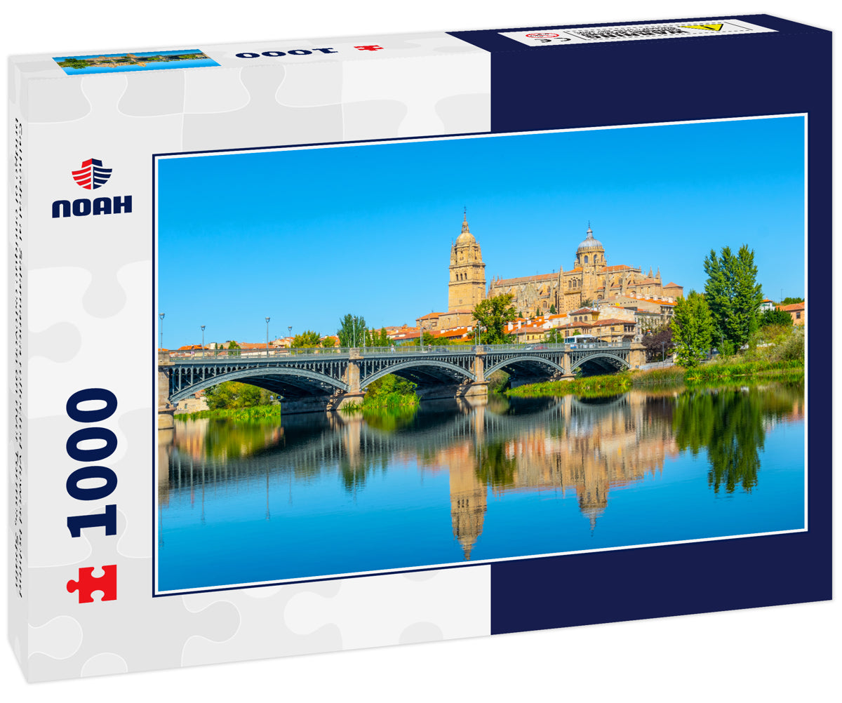 Cathedral at Salamanca reflected viewed behind bridge of enrique esteven on river Tormes, Spain