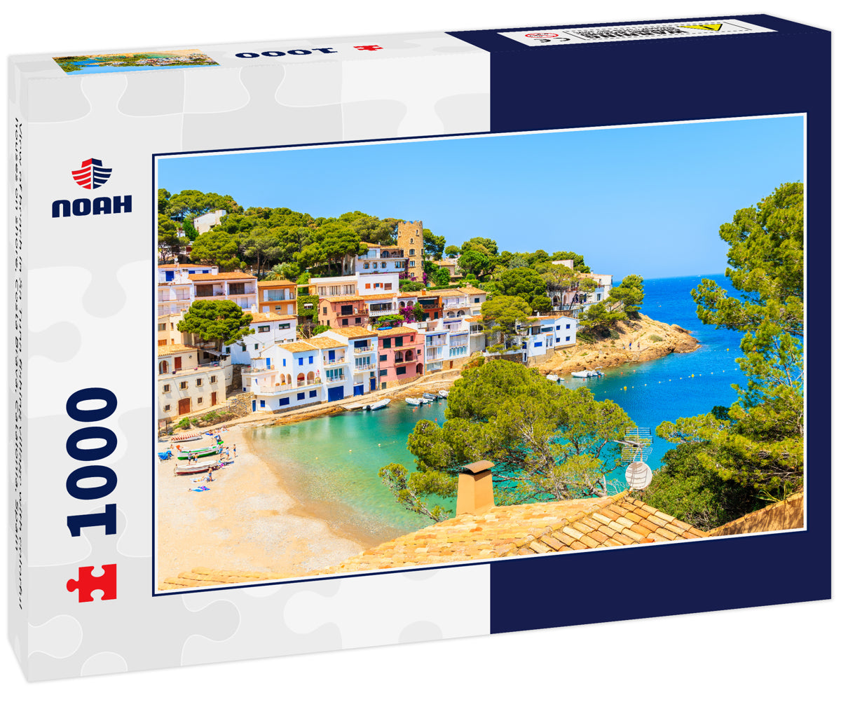 View of beach in Sa Tuna fishing village with colorful houses on shore, Costa Brava, Catalonia, Spain