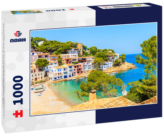 View of beach in Sa Tuna fishing village with colorful houses on shore, Costa Brava, Catalonia, Spain