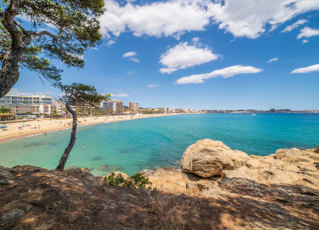 Views of the beach of Palamós with some white clouds, Girona