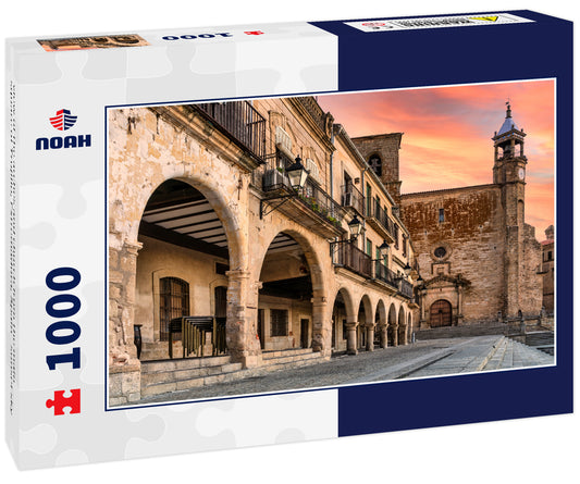 view of the arches and church from the main square of Trujillo, Extremadura, Spain - sunset sky