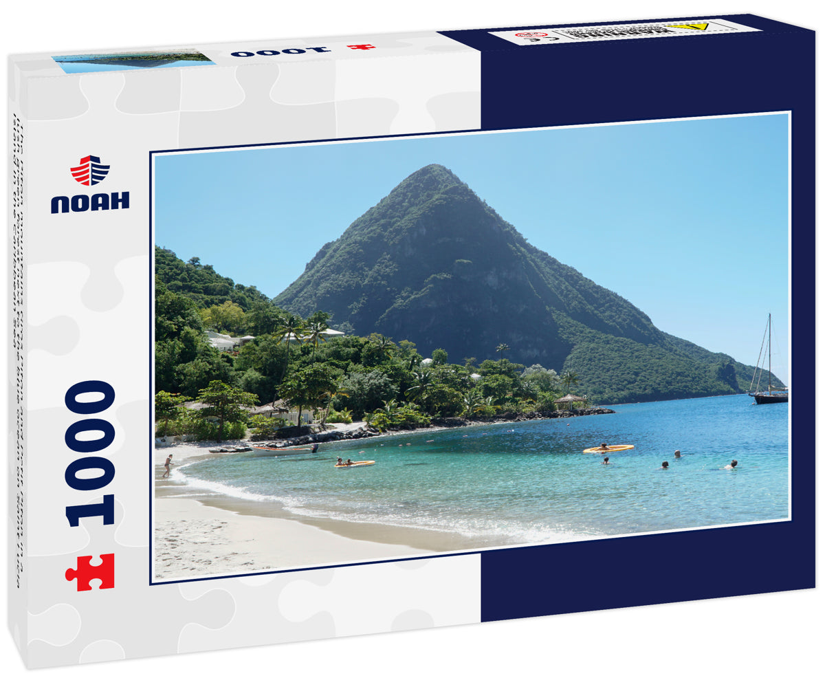 The Piton mountains Gros Piton and Petit Piton in a lush green forest next to the blue ocean on Saint Lucia Island in the Caribbean Sea