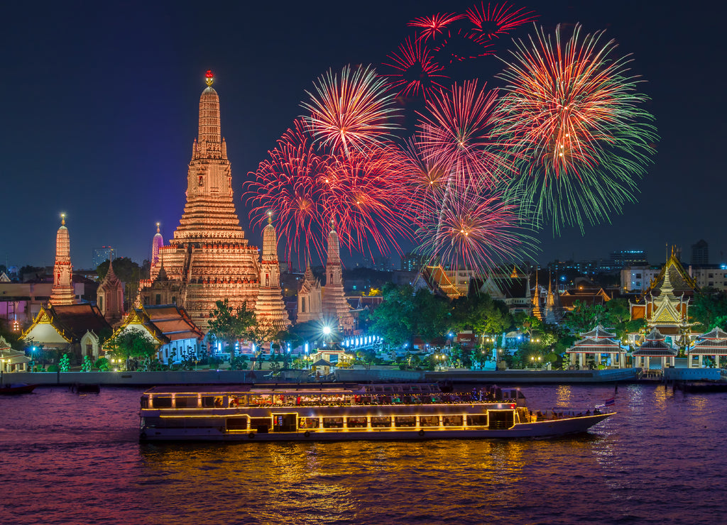Wat arun and cruise ship in night time under new year celebration, Bangkok city,Thailand
