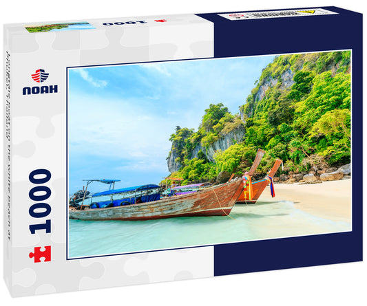 Longtale boat on the white beach at Phuket, Thailand