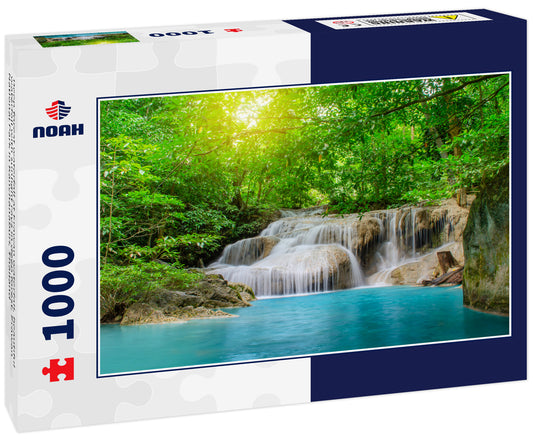 Deep forest waterfall at Erawan waterfall, beautiful waterfall with sunlight rays in deep forest, Erawan National Park in Kanchanaburi, Thailand