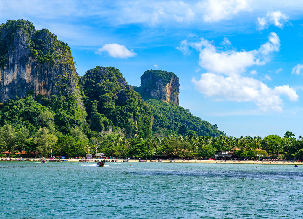 Railay West Beach with beautiful rock formation and landscape scenery in Krabi province - tropical coast with paradise beaches - Thailand