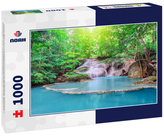 Deep forest waterfall at Erawan waterfall, beautiful waterfall with sunlight rays in deep forest, Erawan National Park in Kanchanaburi