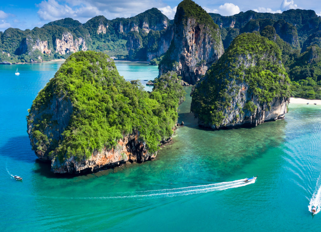 Phra Nang Cave Beach with traditional long tail boat on Ao Phra Nang Beach, Railay Bay, Krabi