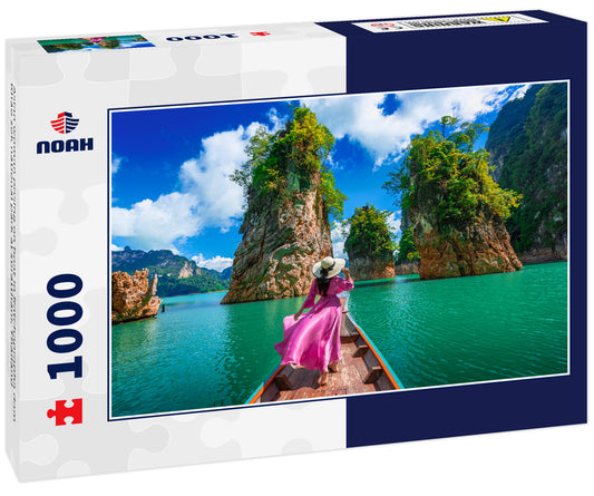 Asian woman posing on boat in Ratchaprapha dam Khao sok national park at suratthani, Thailand