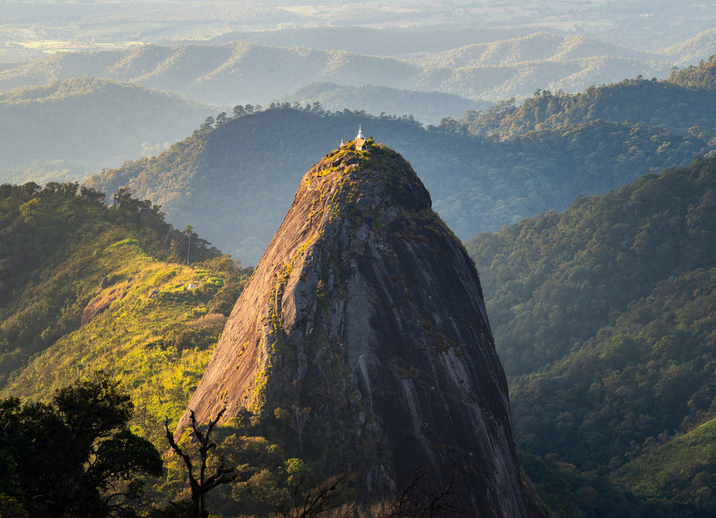 Spectacular view of Doi Nork an iconic huge grey black rock in Doi Luang national park in Phayao province of Thailand at sunset