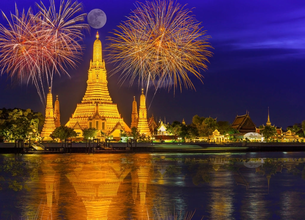 Firework countdown celebration display over temple of dawn on the Chao Praya riverside.New year countdown firework at Wat Arun, Bangkok