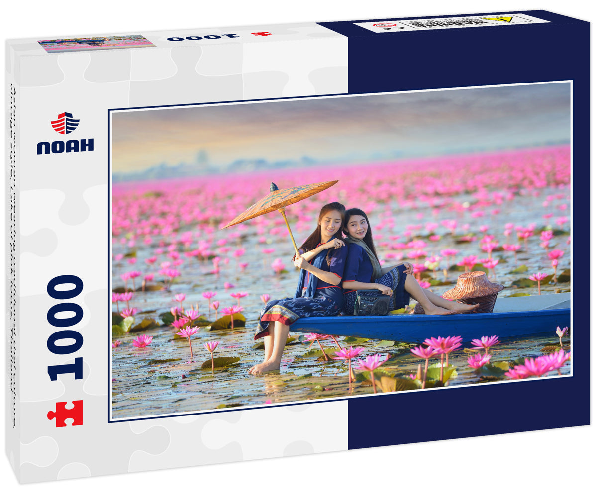 Asian woman wearing traditional thai culture, vintage style, Lake of pink lotus, Thailand