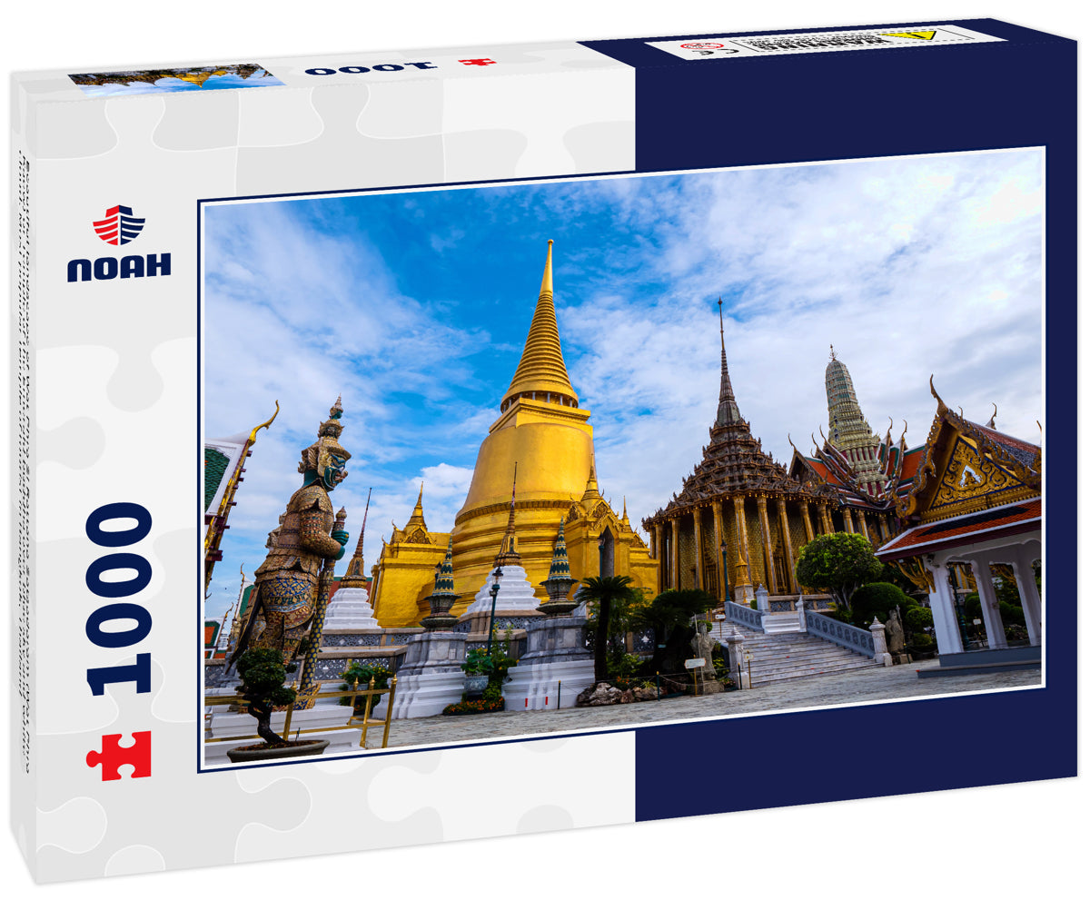 Beautiful landscape of Wat Phra Si Rattana Satsadaram (Wat Phra Kaew) or Temple of the Emerald buddha over blue sky and white cloud. Most popular temple of tourist in Bangkok, Thailand