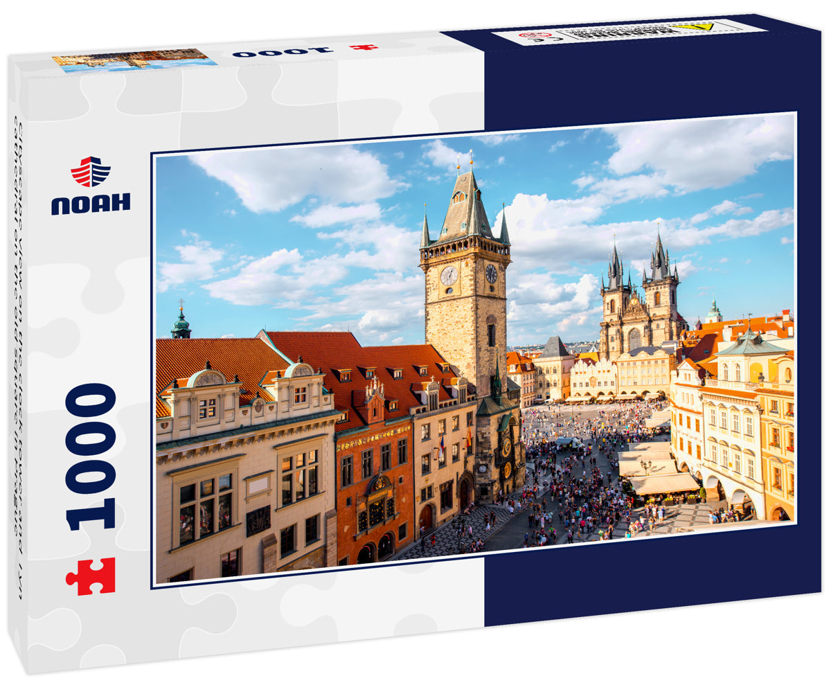 Cityscape view on the clock tower and Tyn cathedral on the old square in Prague