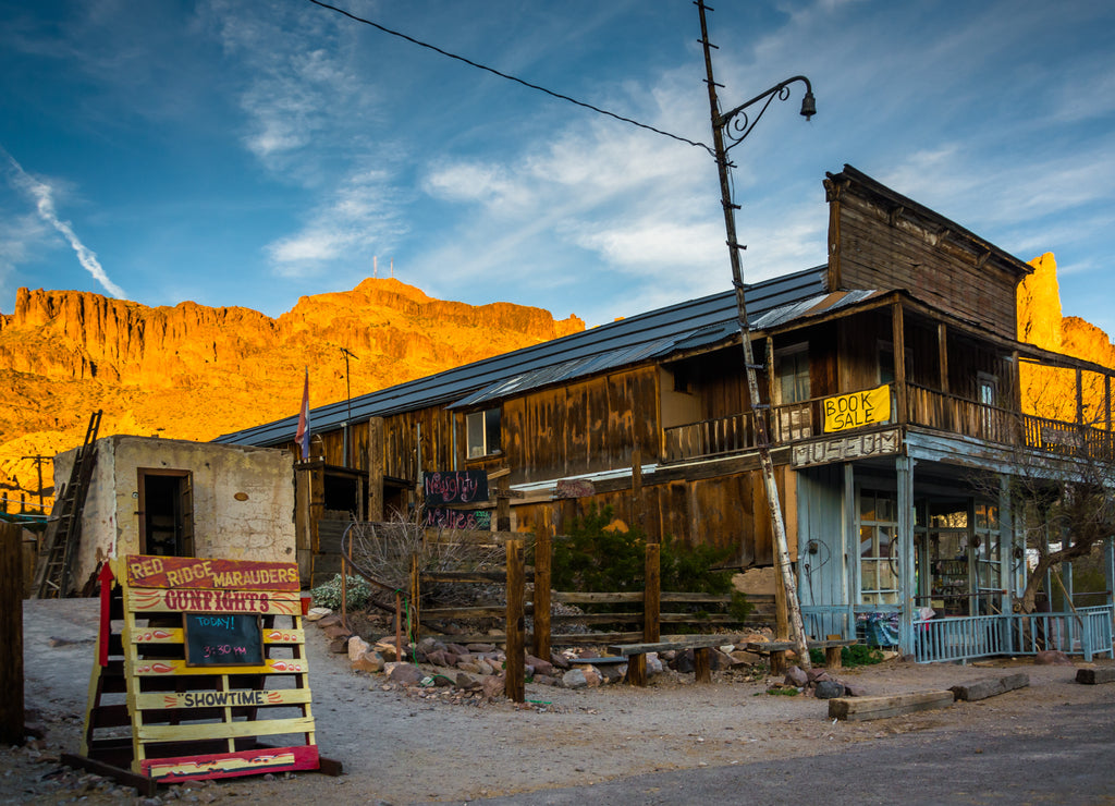 Evening light on a building and mountains in Oatman, Arizona