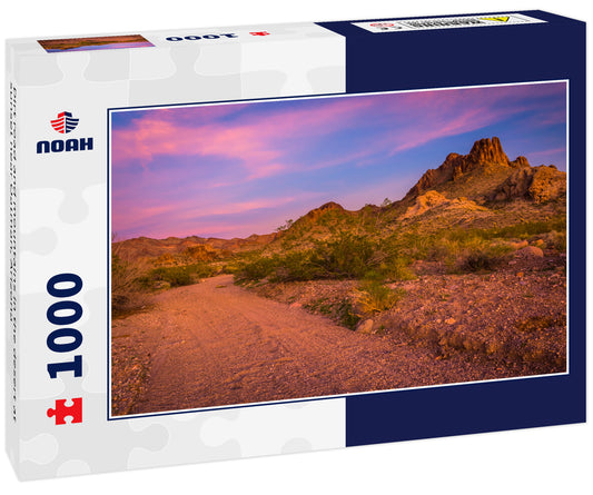 Dirt road and mountains in the desert at sunset near Oatman, Arizona