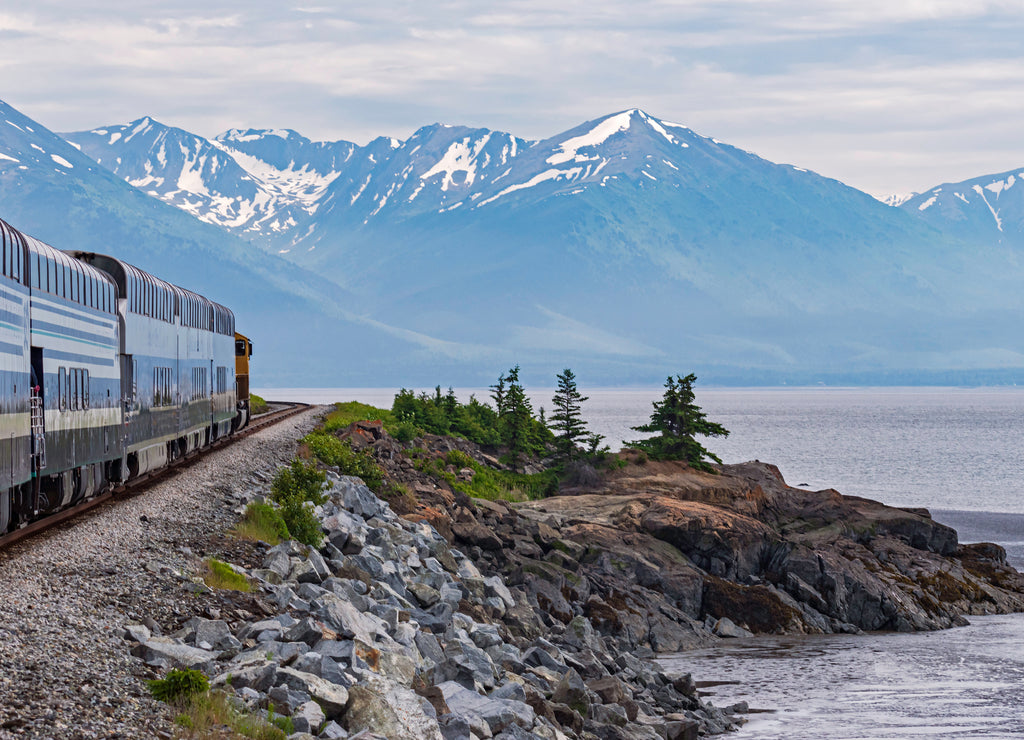 Turnagain Arm of Cook Inlet in Alaska from the Train showing the shoreline with mountains and glaciers in the background