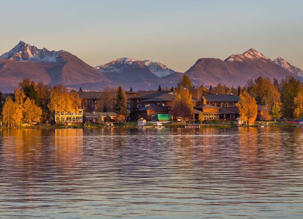 Warm colors of sunset at Spenard Lake in Anchorage, Alaska, USA