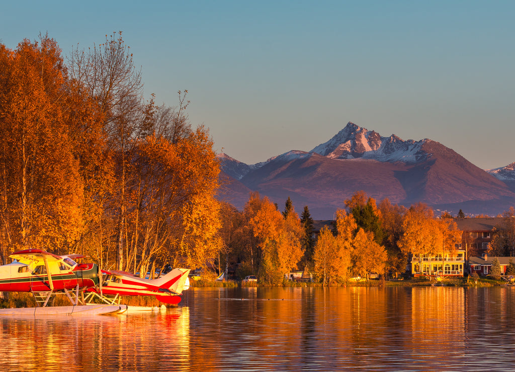 Warm colors of sunset at Spenard Lake in Anchorage, Alaska, USA