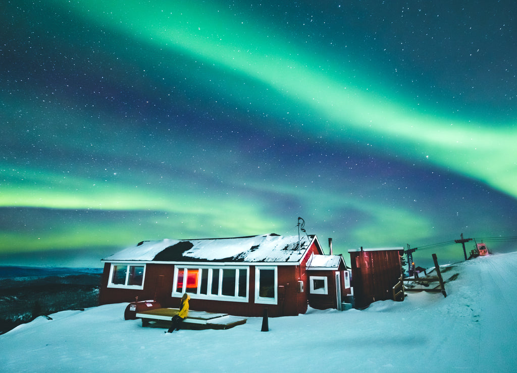 Girl watching Aurora borealis in Fairbanks, Alaska