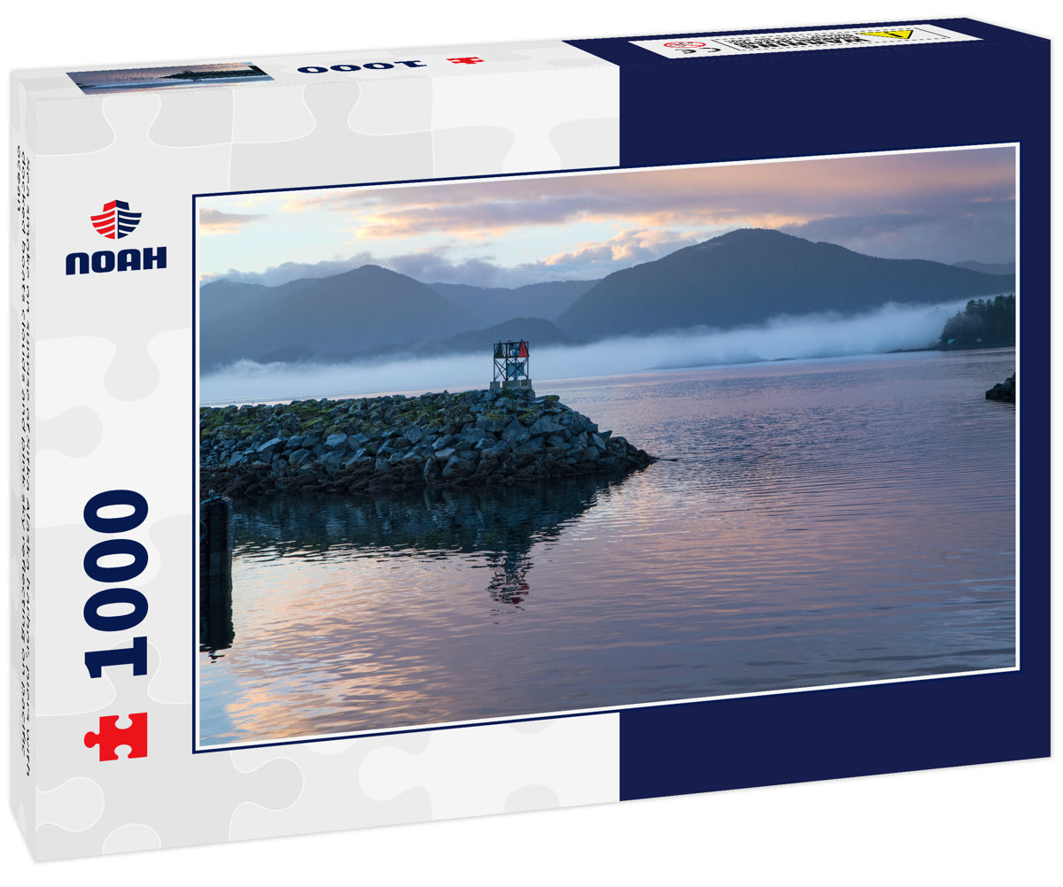 Sea smoke on sunrise of Sitka Alaska harbor, piers with docked boats clouds and pink sky reflecting on pacific ocean