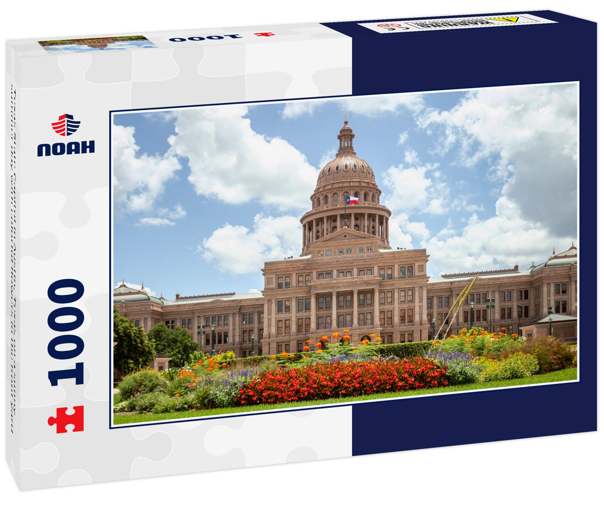 Texas State Capitol in Austin, Texas on a sunny summer day with colorful flowers in the front yard